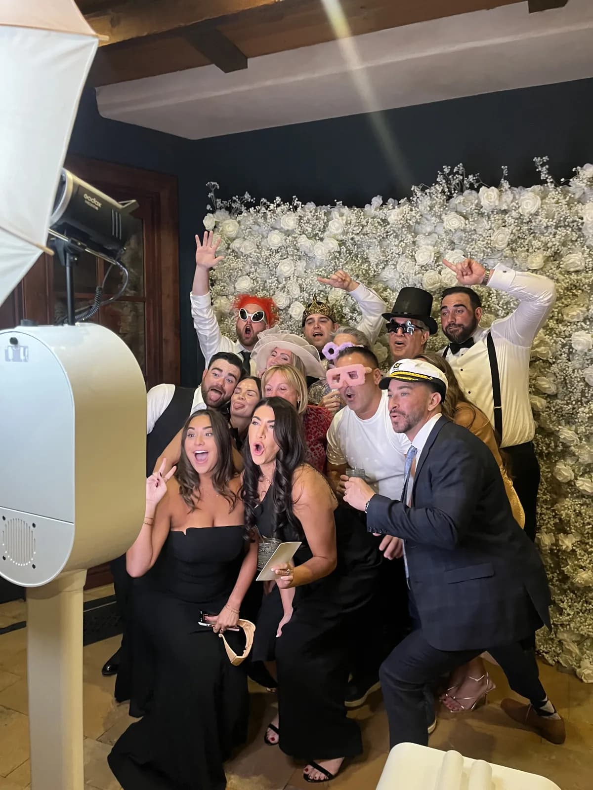 Wedding guests gathering around the Honey Photobooth