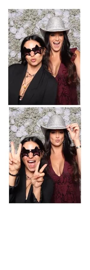 Two guests posing in a printed photo booth strip